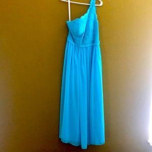 Long blue dress. Worn once. With pockets and side slit. One shoulder.